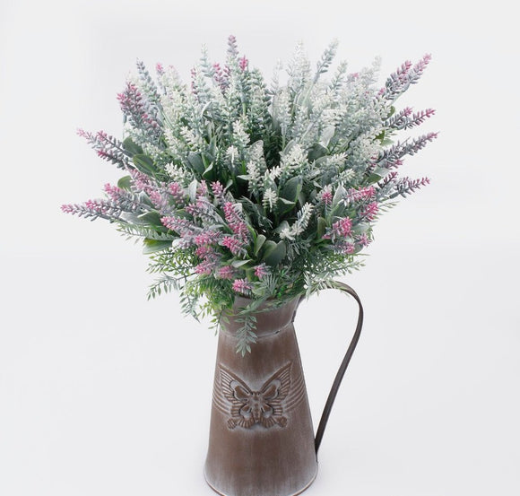 Mixed colour lavender spray in a vase
