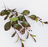Three Artificial leafy branches and berries